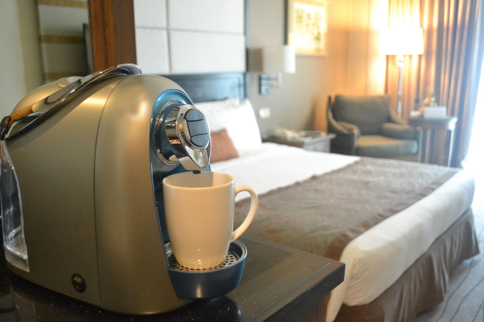 Отель Marco Polo Davao Экстерьер фото A Nespresso machine in a hotel room